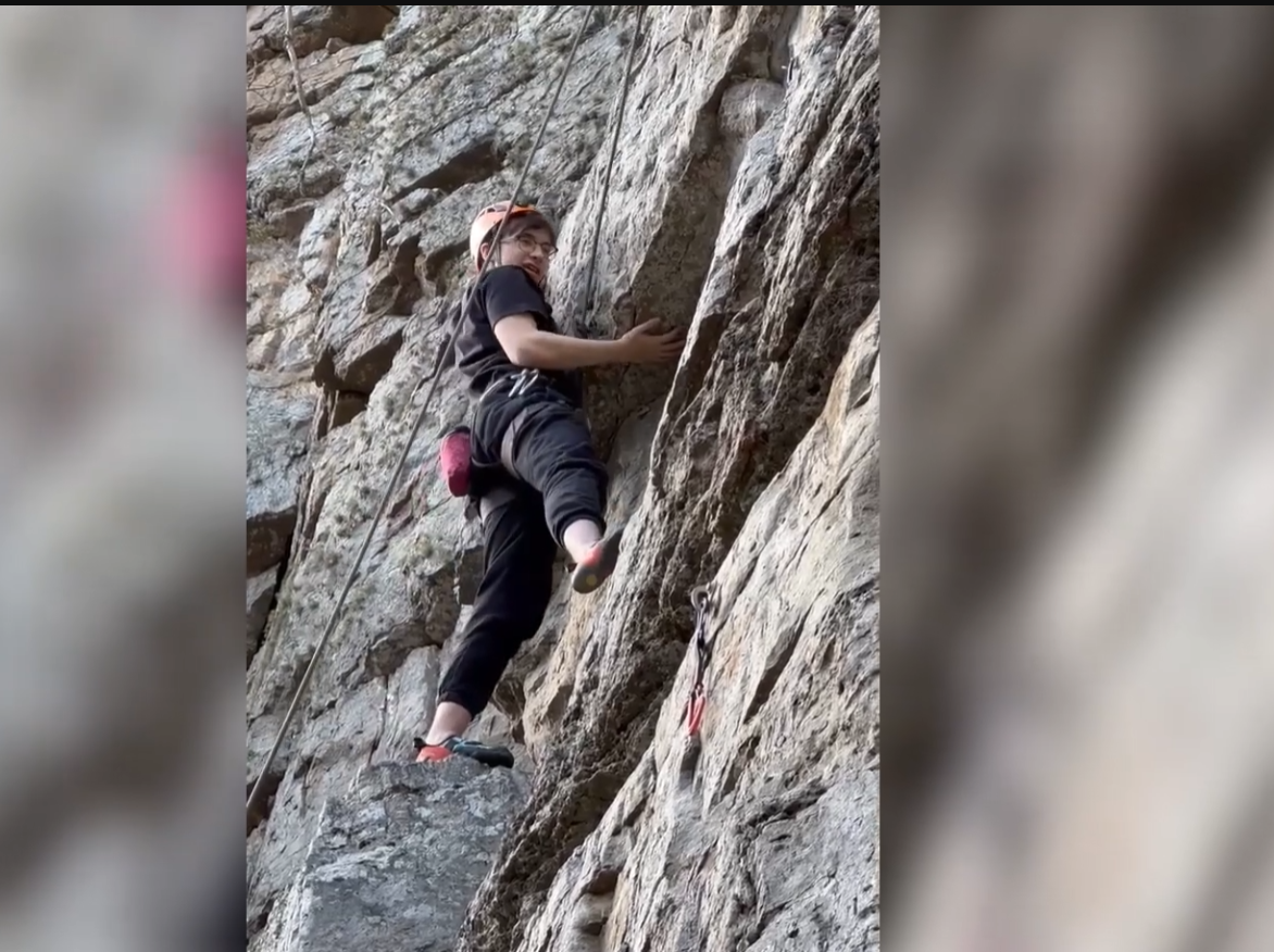 Alex rock climbing outdoors